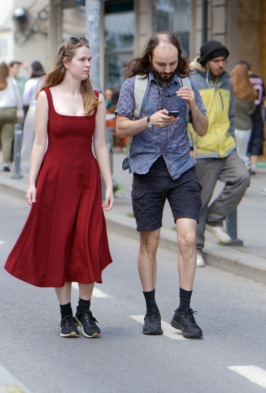 Couple walking down a street in Bucharest, Romania